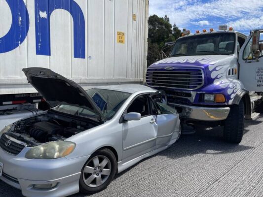 Multiple injuries in H-2 freeway collision involving big rig