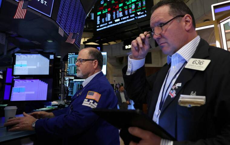 Wall Street closes lower as investors assess data