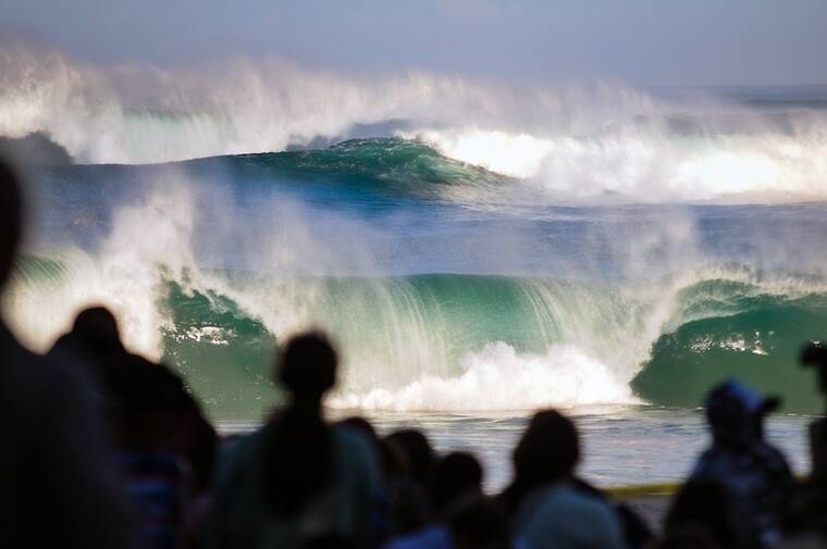 High surf warning begins tonight as muggy, voggy weather persists